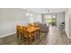 Dining room with views of the living room and backyard through sliding glass doors at 903 Gondola Park Dr # 903, Venice, FL 34292