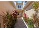 Inviting entryway with lush plants and a charming walkway leading to the front door at 903 Gondola Park Dr # 903, Venice, FL 34292