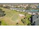 Aerial view of condo buildings featuring screened patios surrounded by lush landscaping on the golf course at 903 Gondola Park Dr # 903, Venice, FL 34292