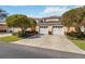Charming two-story home featuring a two-car garage and mature landscaping at 903 Gondola Park Dr # 903, Venice, FL 34292