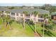 Multi-story home with multiple screened lanais surrounded by lush, mature landscaping at 903 Gondola Park Dr # 903, Venice, FL 34292