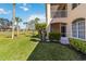 A home featuring an enclosed lanai and lush lawn overlooking the golf course at 903 Gondola Park Dr # 903, Venice, FL 34292