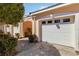 Attached one car garage with a concrete driveway and manicured landscaping at 903 Gondola Park Dr # 903, Venice, FL 34292