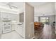 Bright, modern kitchen with white cabinetry and appliances, flowing into the dining room at 903 Gondola Park Dr # 903, Venice, FL 34292