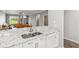 Modern kitchen featuring granite countertops, stainless steel sink, and ample cabinetry at 903 Gondola Park Dr # 903, Venice, FL 34292