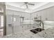 Bright kitchen featuring white cabinets, granite countertops, and stainless steel appliances at 903 Gondola Park Dr # 903, Venice, FL 34292