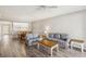 Spacious living room with open floor plan, wood flooring, and eat-in kitchen at 903 Gondola Park Dr # 903, Venice, FL 34292