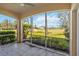 Relaxing screened-in patio with stunning golf course views and tiled floors at 903 Gondola Park Dr # 903, Venice, FL 34292