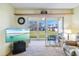 Cozy living room showing access to the screened lanai, perfect for indoor-outdoor living at 944 Capri Isles Blvd # 103, Venice, FL 34292