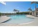 Resort style community pool with zero entry, perfect for leisure and socializing under the palm trees at 9900 Haze Dr, Venice, FL 34292