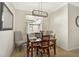Charming dining room featuring a modern light fixture and seating for four at 9900 Haze Dr, Venice, FL 34292