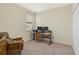 Functional home office space with an adjustable desk and a view to the outside at 9900 Haze Dr, Venice, FL 34292