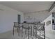 Watercrest community outdoor bar featuring seating for four, sink, and stainless steel storage at 9900 Haze Dr, Venice, FL 34292