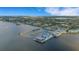 Breathtaking aerial view of waterfront community with marina, lush landscapes, and stunning views of the surrounding waterways at 1 Colony Point Dr # 11A, Punta Gorda, FL 33950