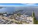Stunning aerial view of waterfront condos with a marina, pool, and ample parking at 1 Colony Point Dr # 11A, Punta Gorda, FL 33950