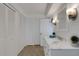Bathroom featuring a white vanity with double doors and lots of storage at 1 Colony Point Dr # 11A, Punta Gorda, FL 33950