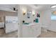 Bright bathroom featuring a white vanity, updated fixtures, and calming decor at 1 Colony Point Dr # 11A, Punta Gorda, FL 33950