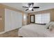 This cozy bedroom features tile floors, a ceiling fan and a large closet at 1 Colony Point Dr # 11A, Punta Gorda, FL 33950