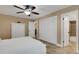Simple bedroom with a queen bed, closet, and adjacent bathroom at 1 Colony Point Dr # 11A, Punta Gorda, FL 33950