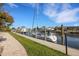 Boat dock with lush landscaping and direct access to the water at 1 Colony Point Dr # 11A, Punta Gorda, FL 33950