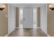 Inviting entryway with tiled floors, a front door, and double closets with lighting at 1 Colony Point Dr # 11A, Punta Gorda, FL 33950