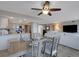 Open-concept floor plan showcasing kitchen, dining area, and living room at 1 Colony Point Dr # 11A, Punta Gorda, FL 33950