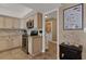 Charming kitchen featuring stainless steel appliances, tile backsplash, and neutral cabinetry at 1 Colony Point Dr # 11A, Punta Gorda, FL 33950