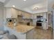 Well-equipped kitchen with granite countertops, stainless steel appliances, and ample cabinet space for storage at 1 Colony Point Dr # 11A, Punta Gorda, FL 33950