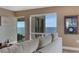 Comfortable living room with ocean views and sliding door access to the balcony at 1 Colony Point Dr # 11A, Punta Gorda, FL 33950