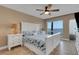 Serene main bedroom with a queen-sized bed, scenic water view, and tile flooring at 1 Colony Point Dr # 11A, Punta Gorda, FL 33950