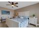 Comfortable main bedroom featuring a queen-sized bed, side tables, and a tranquil setting at 1 Colony Point Dr # 11A, Punta Gorda, FL 33950