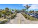 Well-maintained parking lot surrounded by palm trees and lush landscaping, providing ample parking for guests and residents at 1 Colony Point Dr # 11A, Punta Gorda, FL 33950