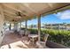 Covered patio with comfortable seating overlooking the canal at 1 Colony Point Dr # 11A, Punta Gorda, FL 33950