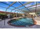 Community swimming pool with a covered structure and plenty of space for leisure at 1 Colony Point Dr # 11A, Punta Gorda, FL 33950