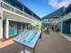 Charming shopping center featuring a directory sign and quaint storefronts under a bright sky at 1 Colony Point Dr # 11A, Punta Gorda, FL 33950