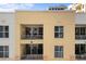 Close-up of condos with balconies featuring sliding glass doors and metal railings at 100 Central Ave # C619, Sarasota, FL 34236