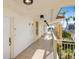 Spacious balcony with serene outdoor views and access to well-lit hallway at 100 Central Ave # C619, Sarasota, FL 34236