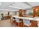 Elegant bar area with quartz countertop, custom wood cabinets, and seating for entertaining at 100 Central Ave # C619, Sarasota, FL 34236