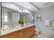Spacious bathroom with a double sink vanity, a large mirror, and neutral tones for a clean and modern feel at 100 Central Ave # C619, Sarasota, FL 34236