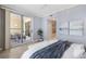 Bright bedroom with a private balcony, showcasing natural light and comfortable outdoor furniture at 100 Central Ave # C619, Sarasota, FL 34236