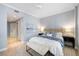 Light, airy bedroom with a plush bed, soft blue accents, and stylish decor, creating a peaceful retreat at 100 Central Ave # C619, Sarasota, FL 34236