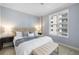 Bright bedroom featuring a comfortable bed, stylish nightstands, and a well-lit window for a cozy atmosphere at 100 Central Ave # C619, Sarasota, FL 34236
