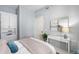 This bedroom has light blue walls with a white trim and furniture for a calm feel at 100 Central Ave # C619, Sarasota, FL 34236