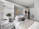 This bedroom features a Murphy bed with built-in shelving and plenty of storage at 100 Central Ave # C619, Sarasota, FL 34236