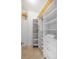 Organized walk-in closet with custom shelving and storage solutions for maximizing space and style at 100 Central Ave # C619, Sarasota, FL 34236