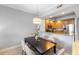 Dining room with a contemporary table and chairs next to a pass through to the kitchen at 100 Central Ave # C619, Sarasota, FL 34236