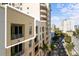 Low angle shot of tan condos with private balconies on a sunny day at 100 Central Ave # C619, Sarasota, FL 34236