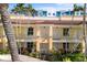 A beautiful exterior view of the units with well-manicured landscaping at 100 Central Ave # C619, Sarasota, FL 34236