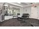 Modern gym with mirrored wall, exercise equipment, and free weights for a complete workout at 100 Central Ave # C619, Sarasota, FL 34236