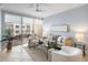 Comfortable living room showcasing stylish seating and a balcony with outdoor furniture at 100 Central Ave # C619, Sarasota, FL 34236